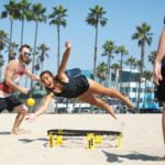 a man doing a handstand on a skateboard