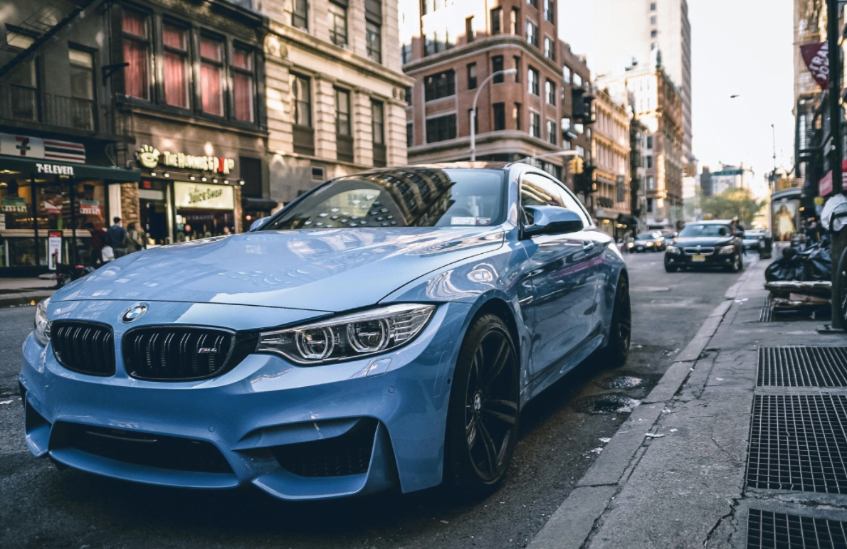 Blue BMW car demonstrating level one and level two autonomous driving technology.