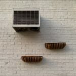 a couple of wooden boxes on a white wall