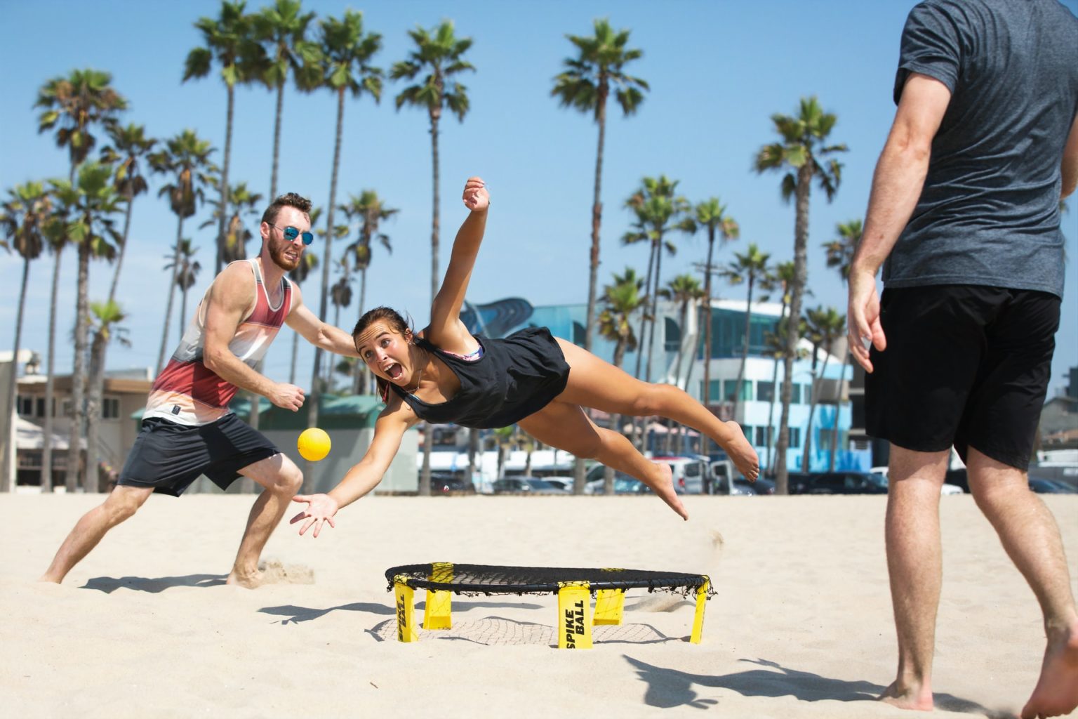 a man doing a handstand on a skateboard