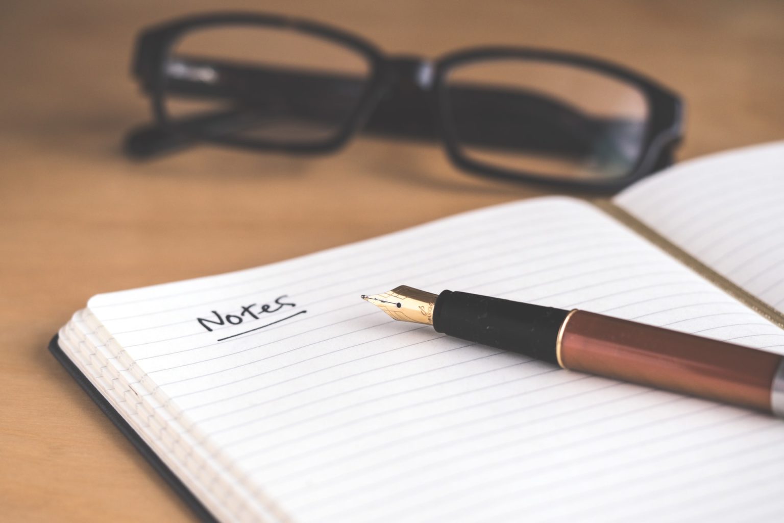 a pen on top of a book