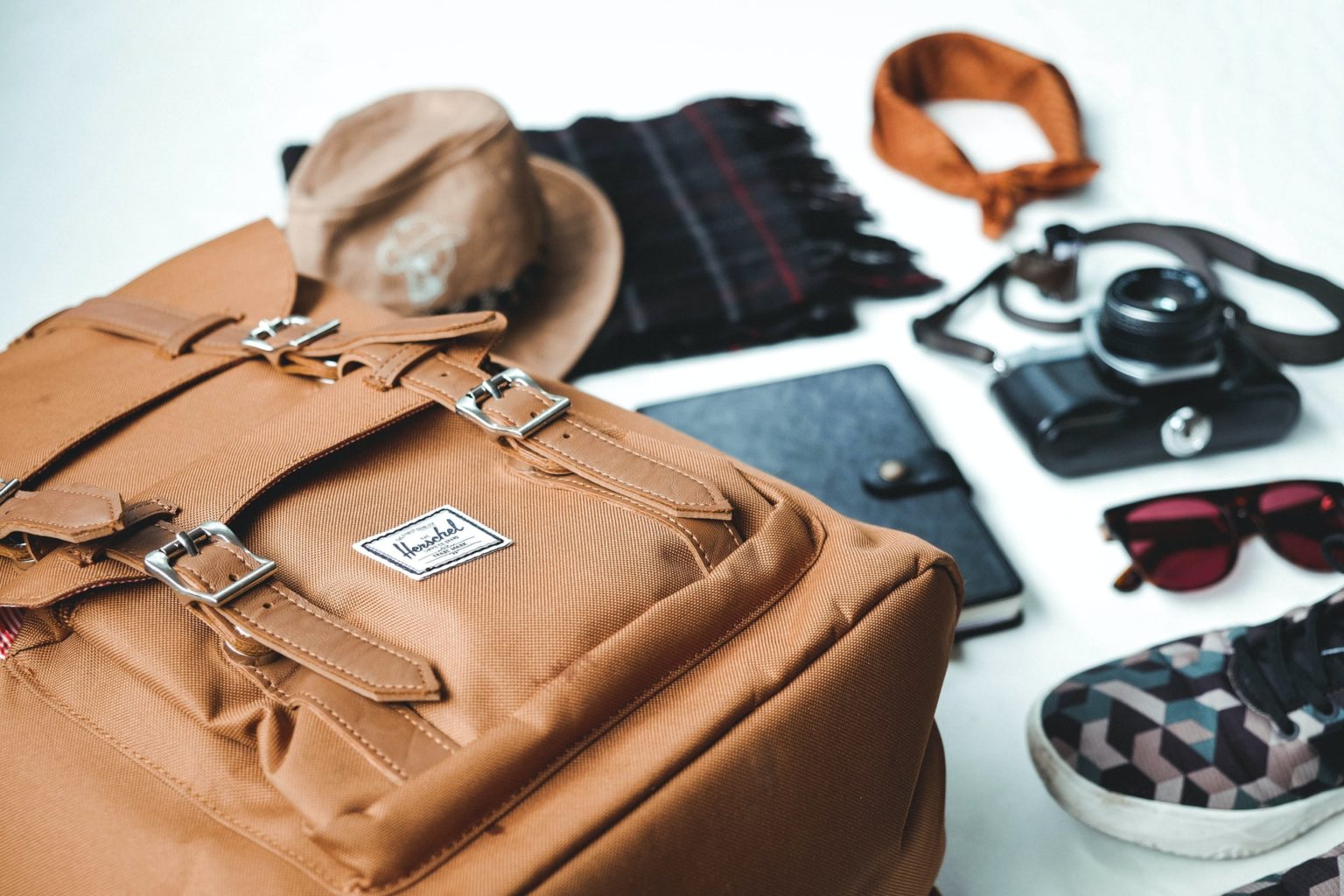 a brown leather bag with a brown leather bag and a white shirt