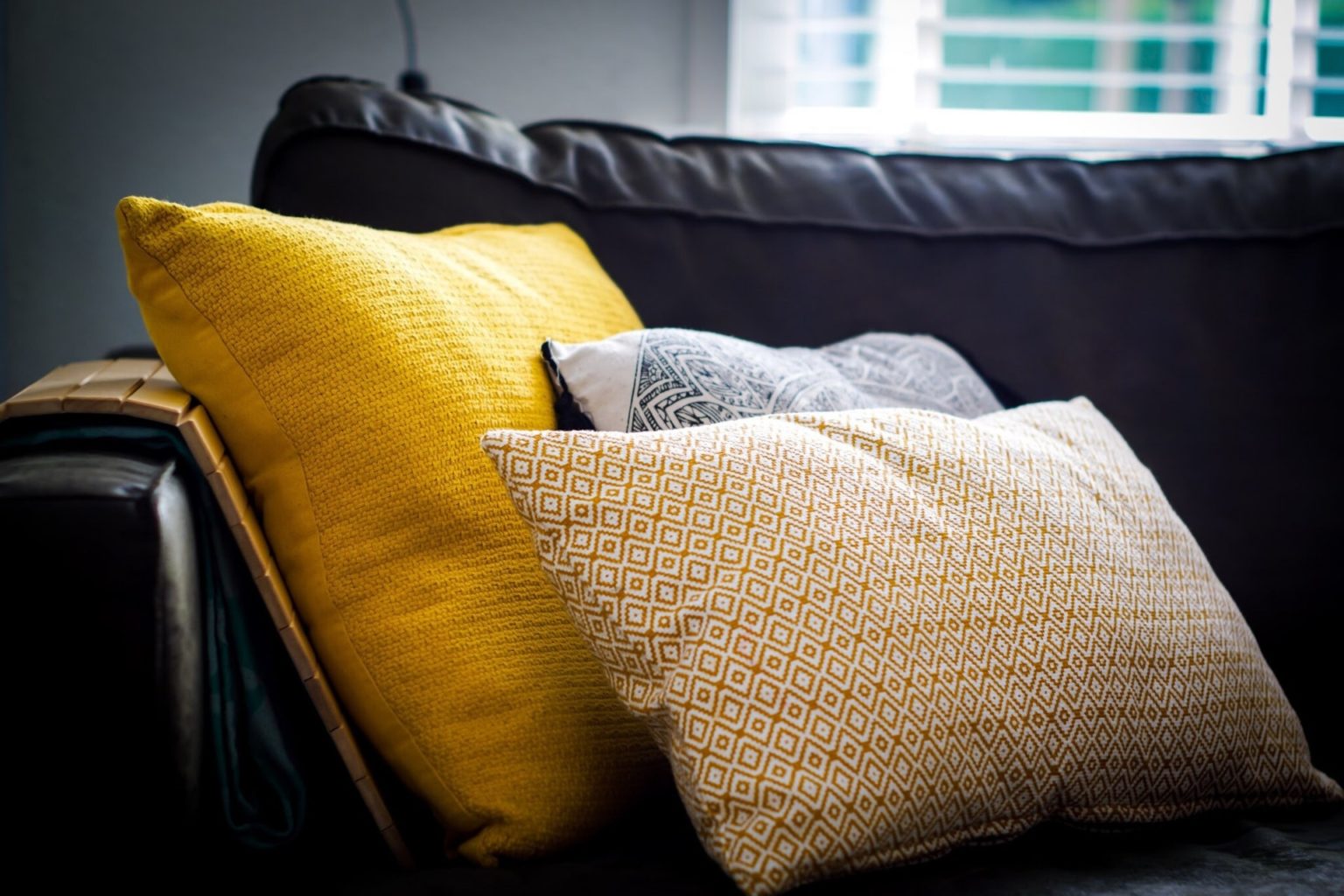 a yellow blanket on a couch