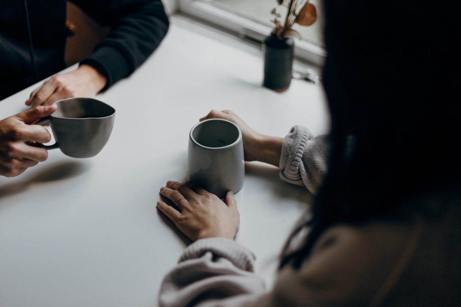 a group of people holding cups