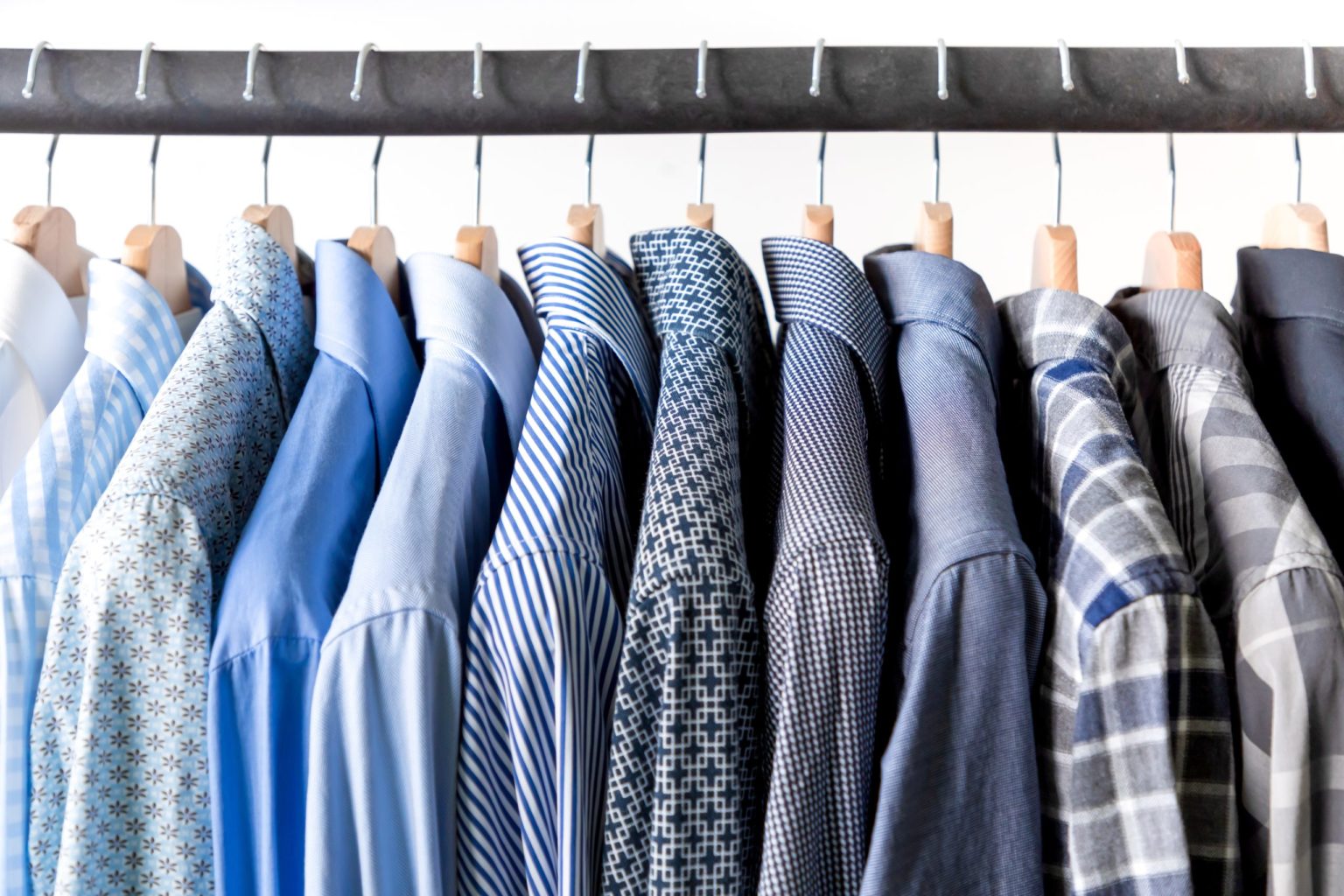 a group of ties on a rack