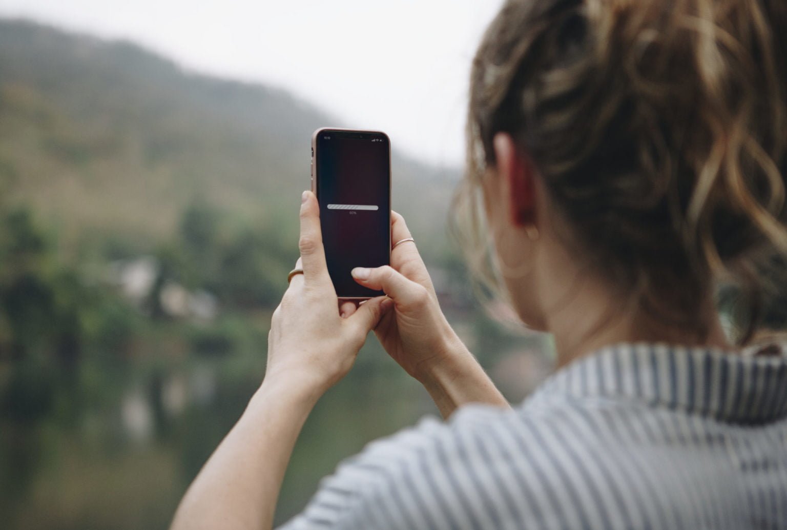 a woman holding a phone