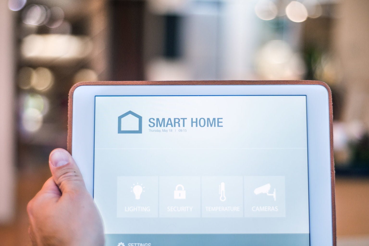 A tablet with smart home control system.