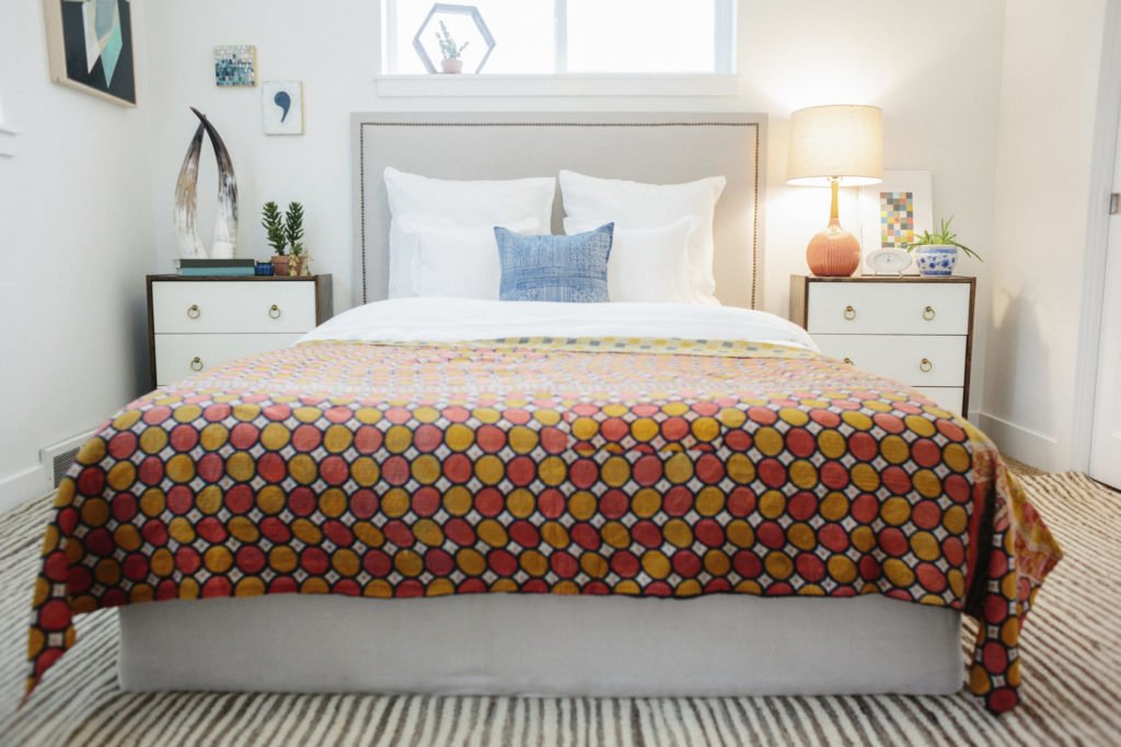 A bed with a retro quilt