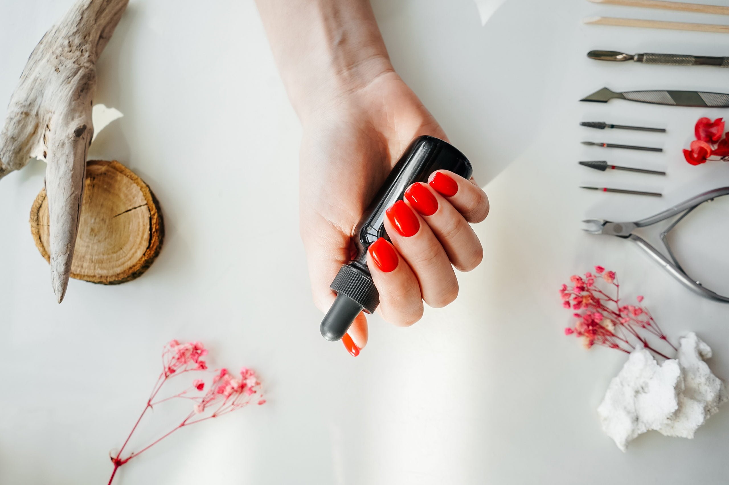 Manicured woman's nails with red nail polish