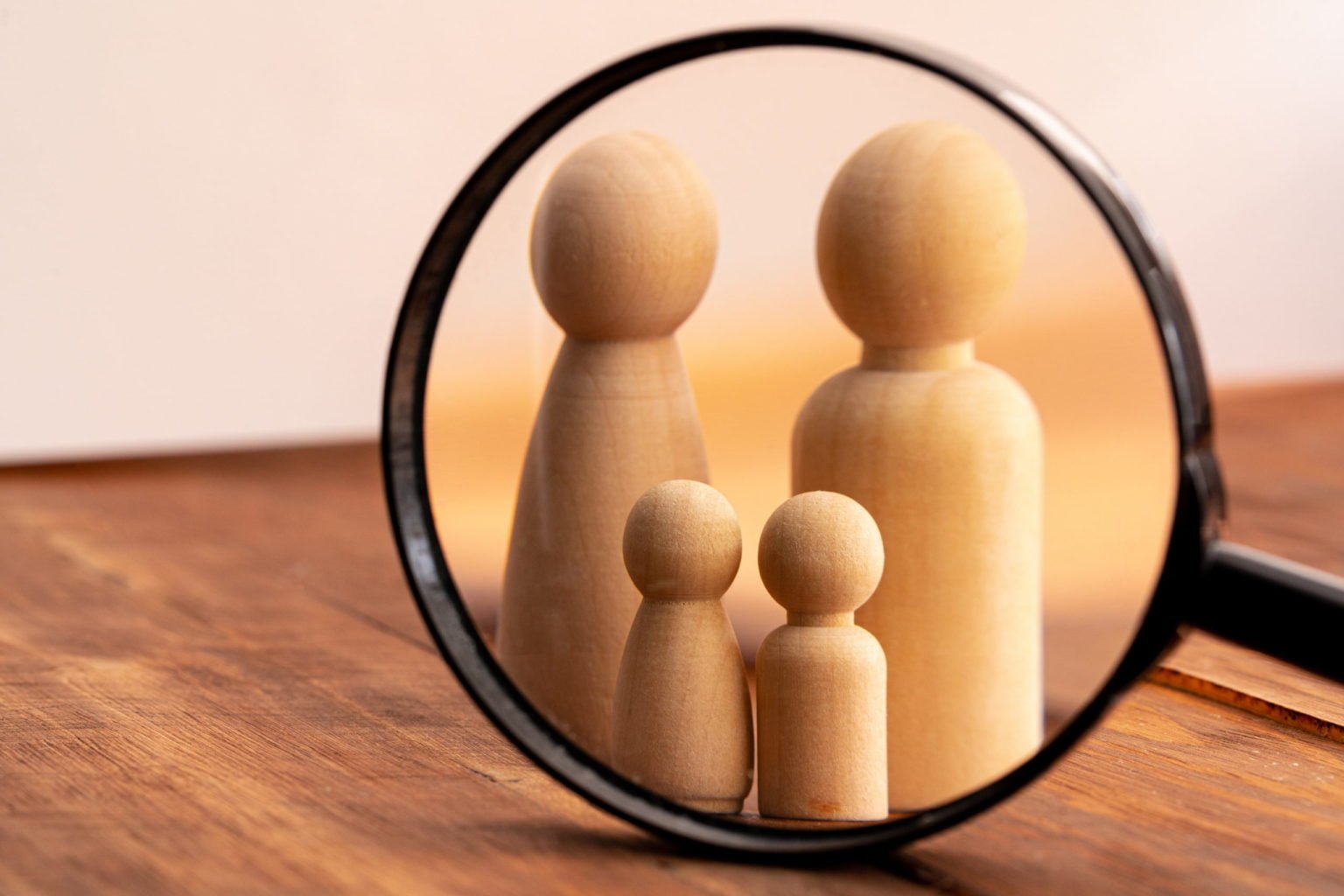 Small wooden figures of family members. Family relationship symbol