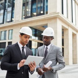 Engineers working on tablet pc