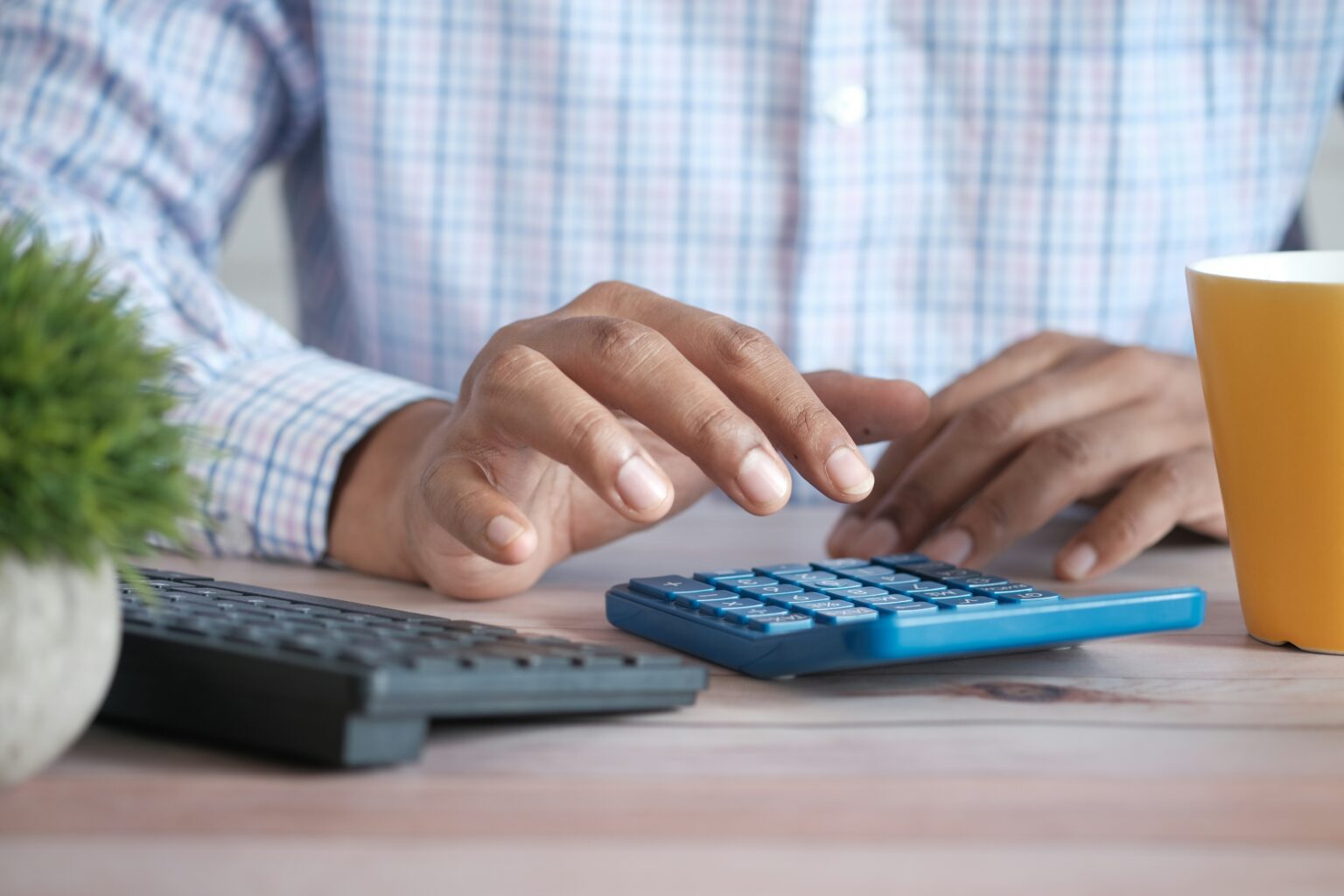 a person typing on a keyboard