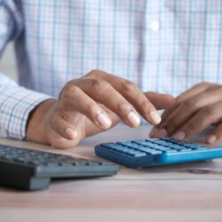 a person typing on a keyboard